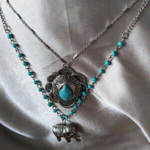 Lane Bryant necklace + ceremonial elephants